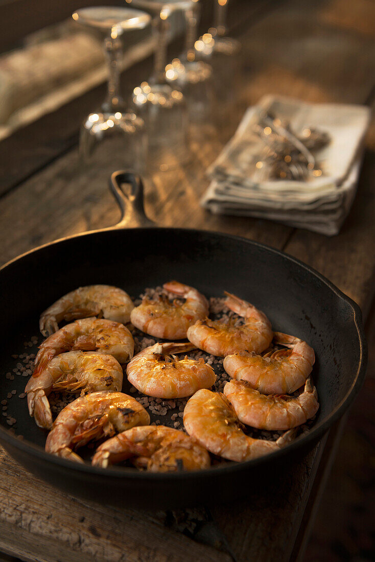 Frying shrimp in pan, Richmond, VA, USA