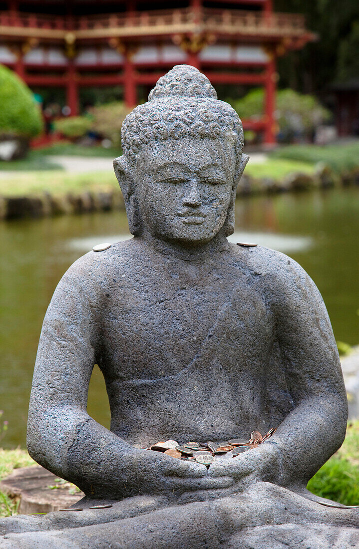 Stone Buddha with Offerings, Kaneohe, Oahu, Hawaii, USA