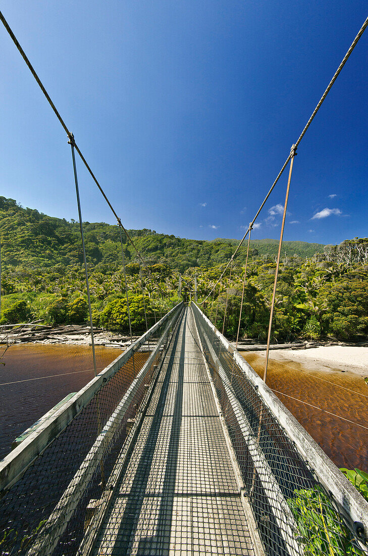 Suspension bridge over tropical beach, Kahurangi, Kahurangi, new zeland
