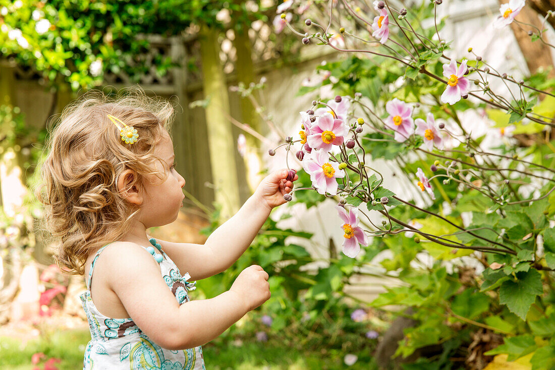 Caucasian girl in garden, Portland, OR, USA