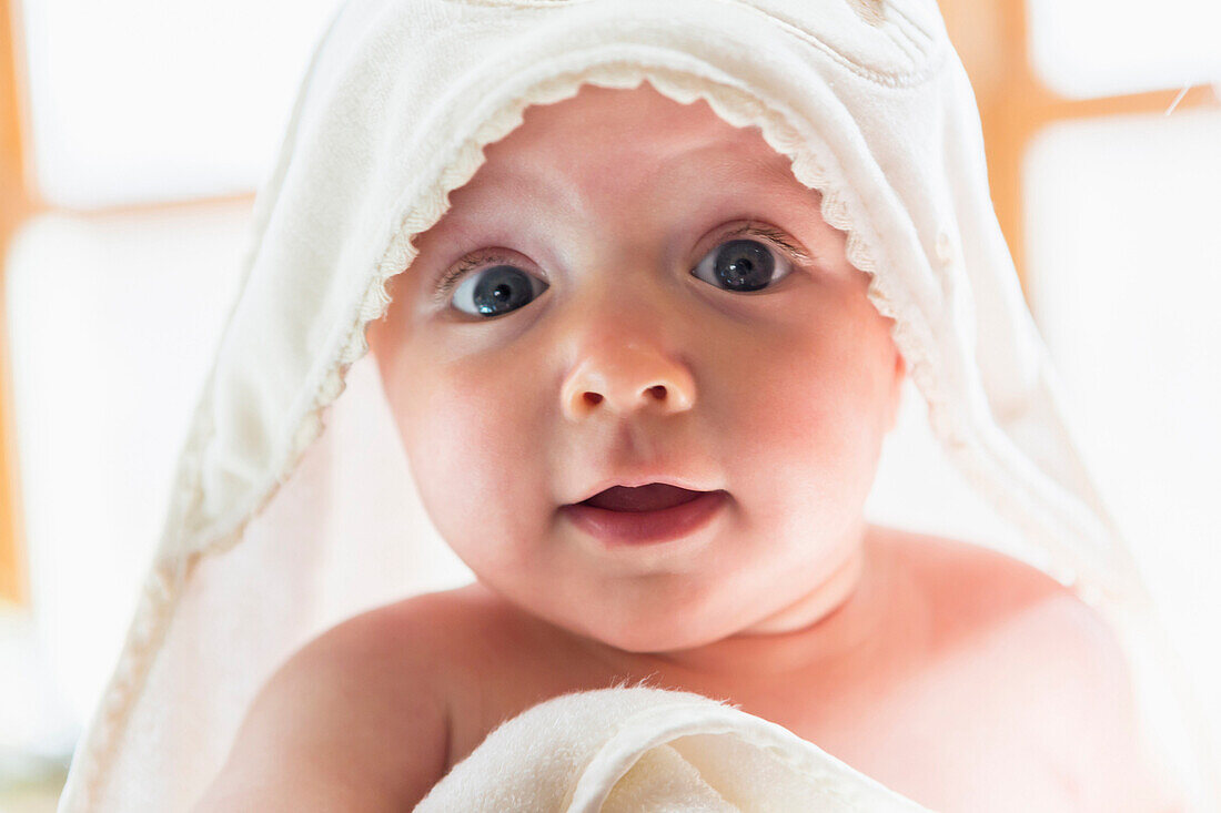 Caucasian baby wrapped in towel, Santa Fe, New Mexico, USA