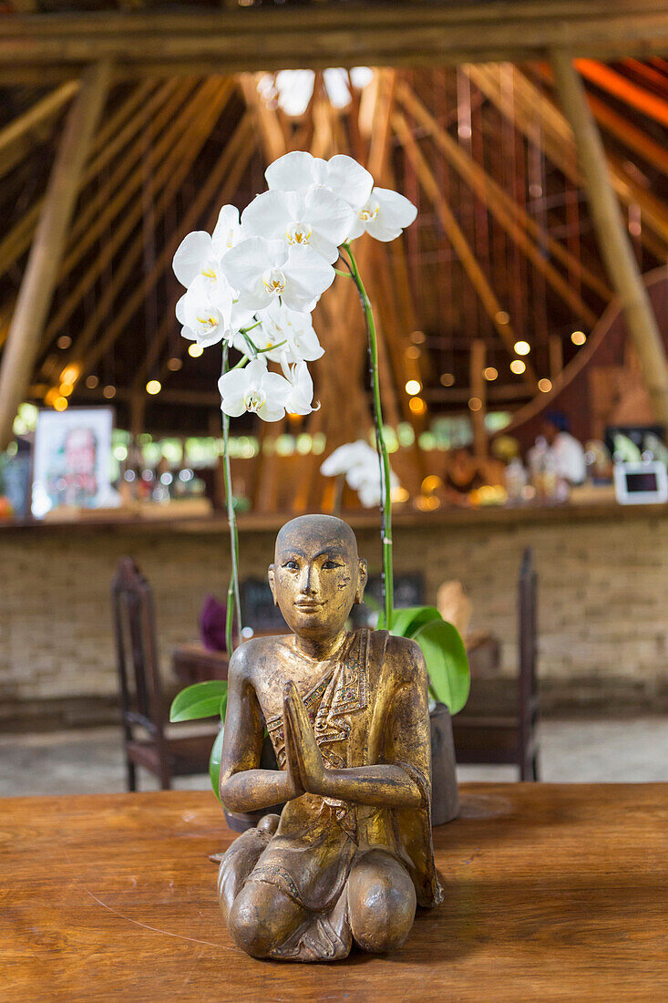 Hindu statue and orchid, Ubud, Bali, Indonesia, Ubud, Bali, Indonesia