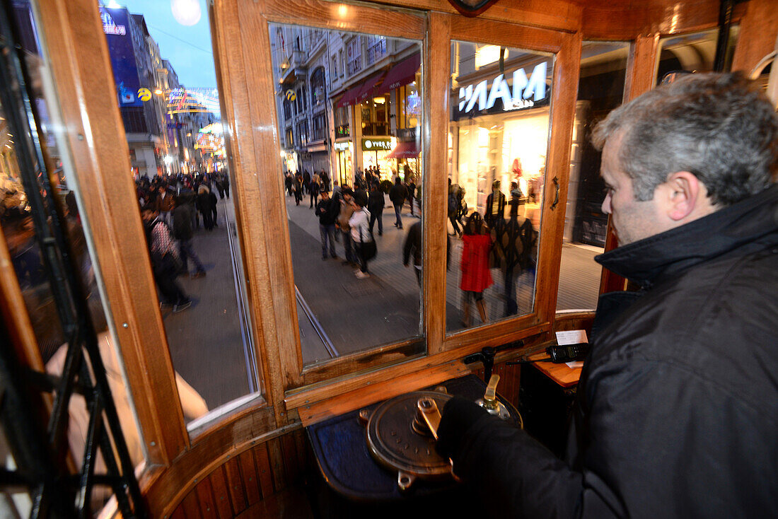 Tram passing Istiklal Street in the evening, Beyoglu, Istanbul, Turkey