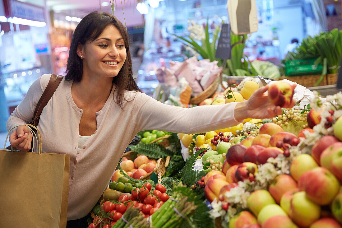 35 year old woman buying fruit. Shopping at the Bretxa Market. Donostia. San Sebastian. Gipuzkoa. Basque Country. Spain.