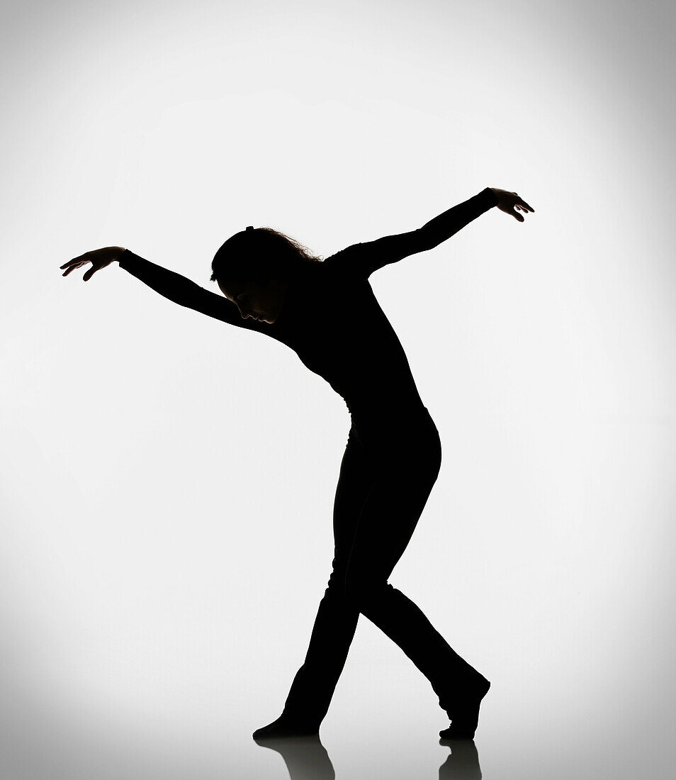 Silhouette of woman dancing