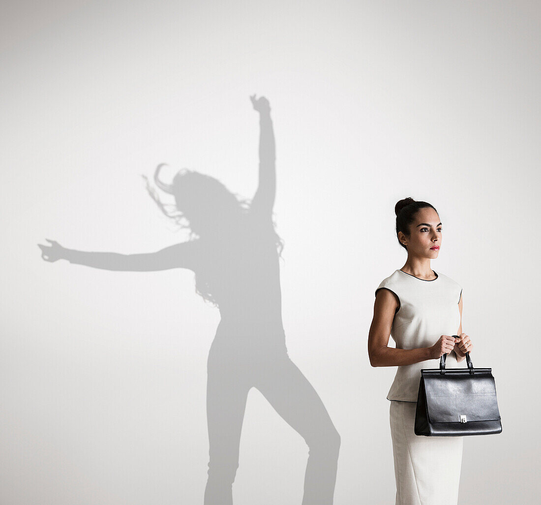 Woman with shadow in background dancing