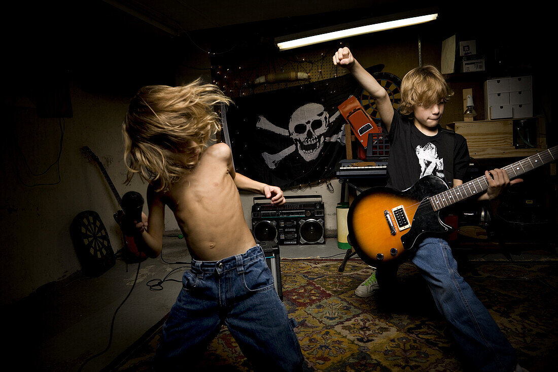 Young brothers playing rock music