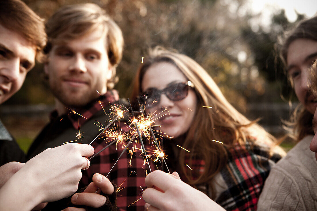 Friends holding sparklers