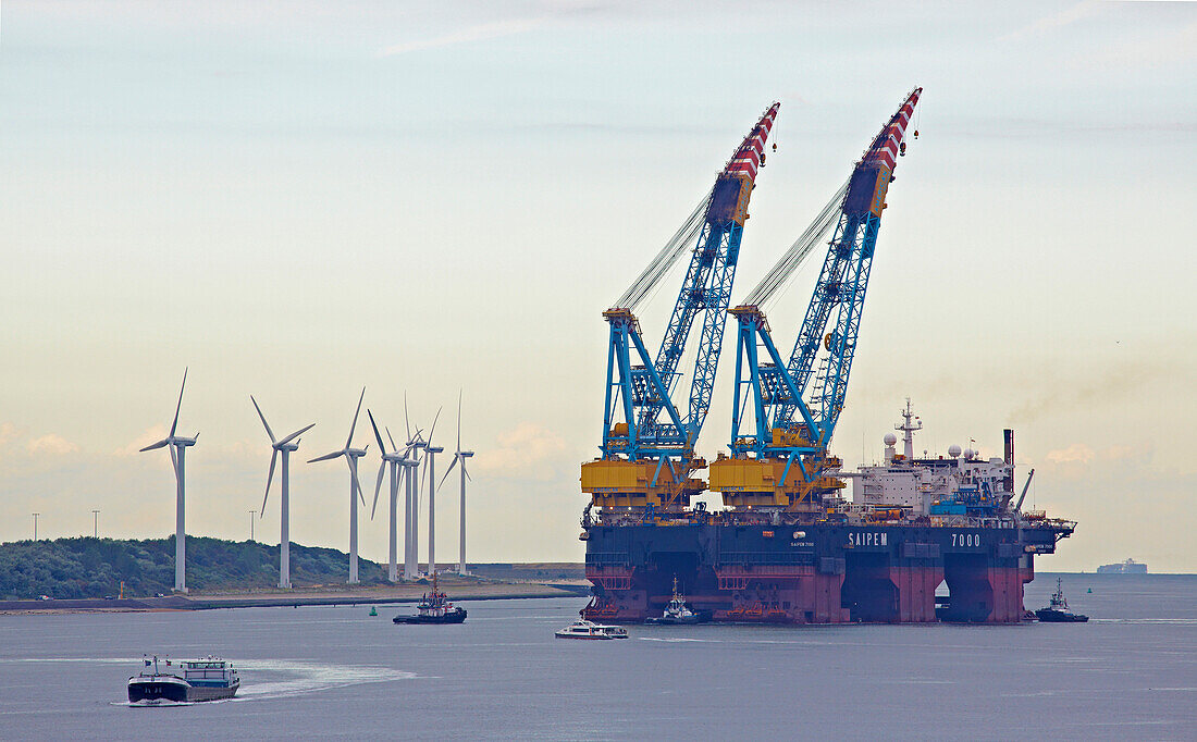 Freighters, wind power station and Europort near Hoek van Holland, Mouth of the river Rhine, Province of Southern Netherlands, South Holland, Netherlands, Europe