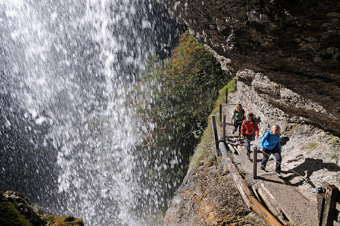 Female hikers passing Staubfall, Heutal, Unken, Salzburg, Austria, Ruhpolding, Chiemgau, Bavaria, Germany