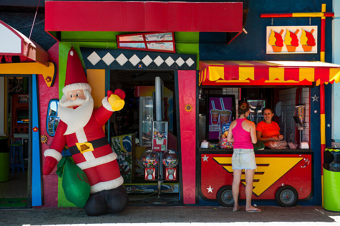 Snack stand with inflatable Santa Claus, Ilhabela, Sao Paulo, Brazil