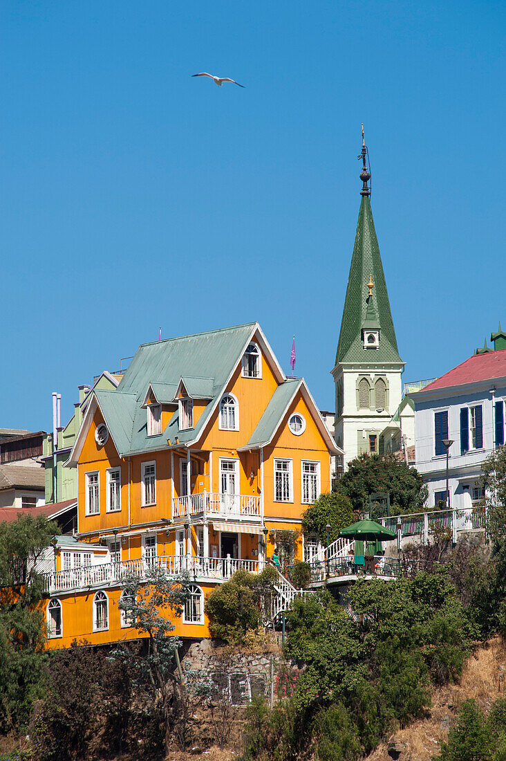 Yellow wooden house and church, Valparaiso, Valparaiso, Chile