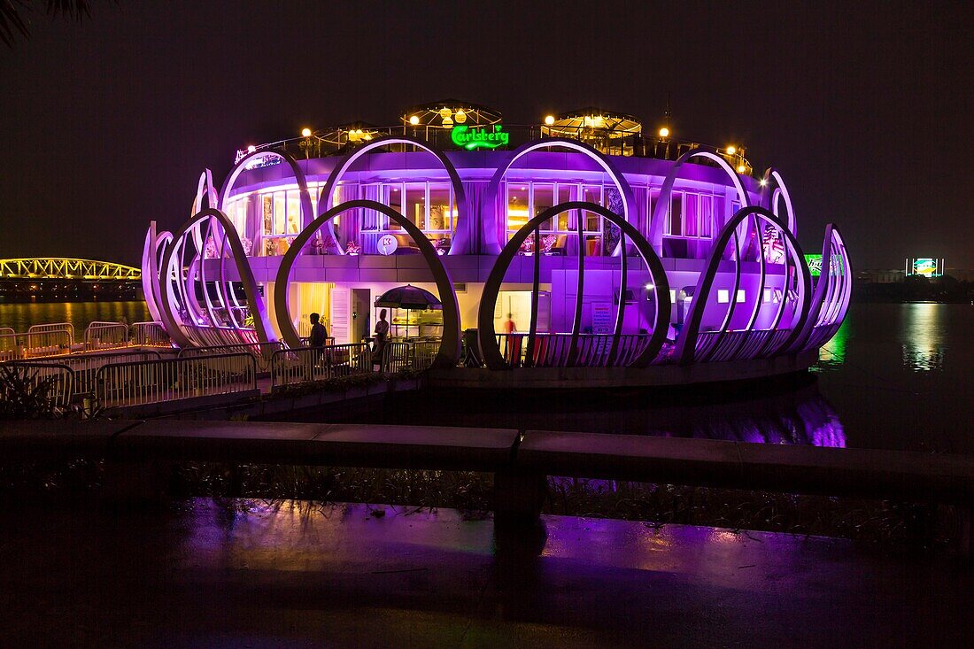 The Song Huong floating restaurant illuminated at night in Hue, Vietnam, Asia.