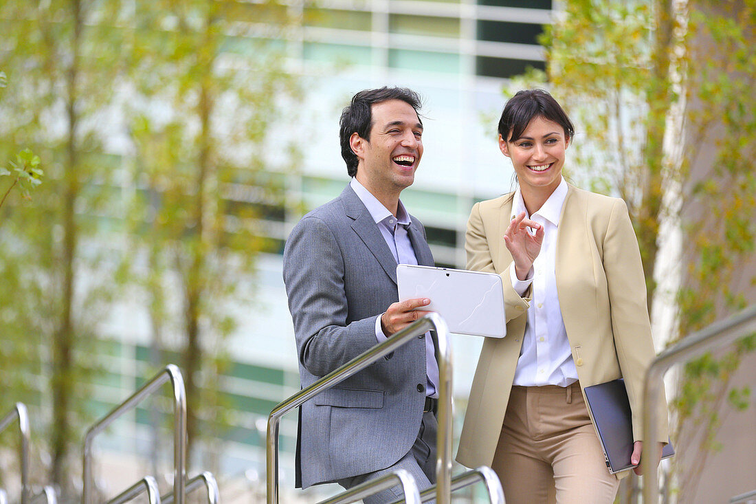 Businesswoman and businessman talking on stairs. business center. San Sebastian Technology Park. Donostia. Gipuzkoa. Basque Country. Spain.