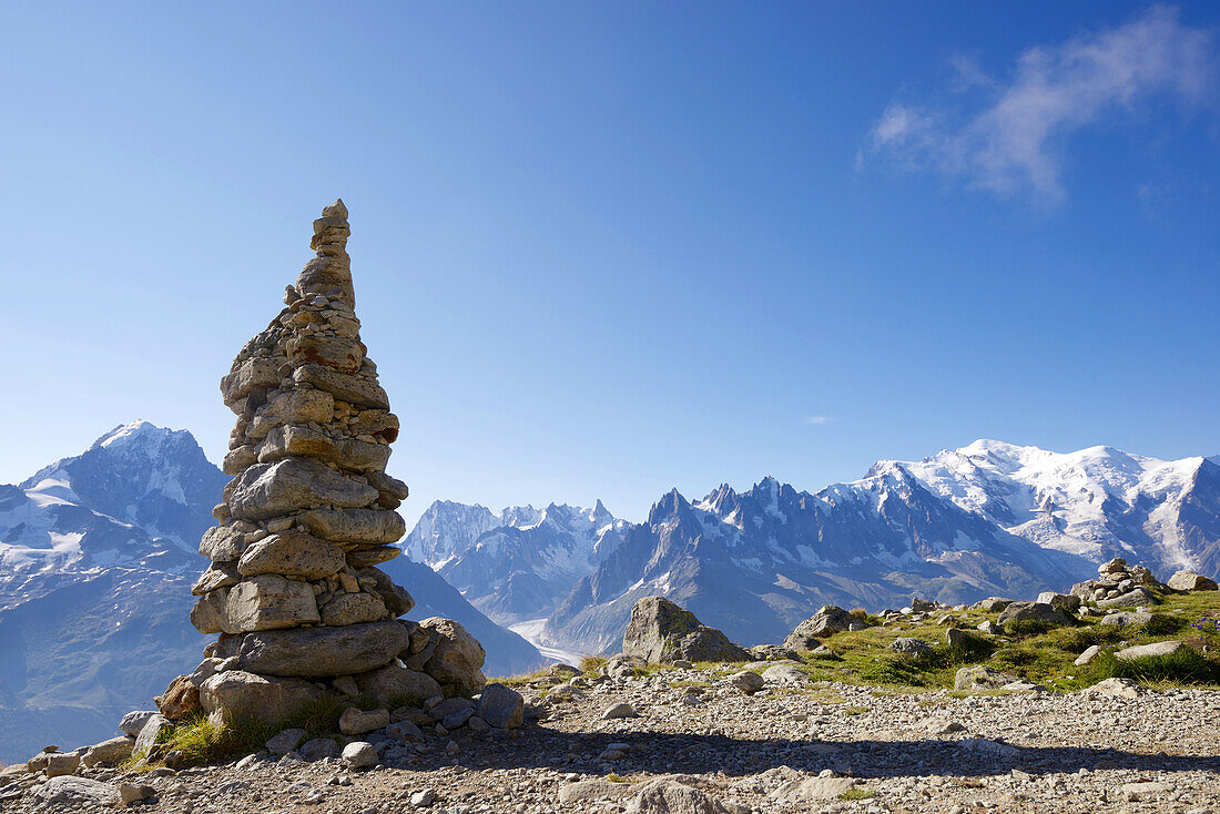 Cairn, at background can be seen the Mont Blanc Peak, Mont Blanc Massif, Alps, Chamonix, France.