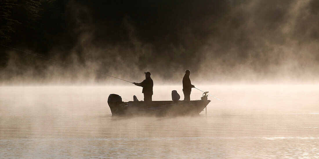Two Men Fishing Off Their Boat On A … – License image – 70476702