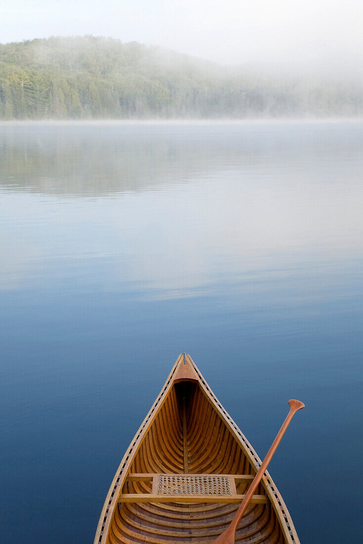 Bow Of Canoe On Calm Blue Lake, Algonquin Park, Ontario