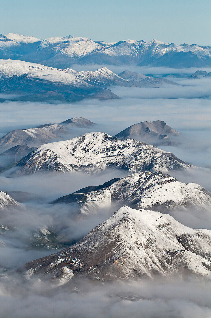 Aerial View Of Fog Rolling Over The Northern Edge Of The Brooks Range In Gates Of The Arctic National Park & Preserve, Arctic Alaska, Summer