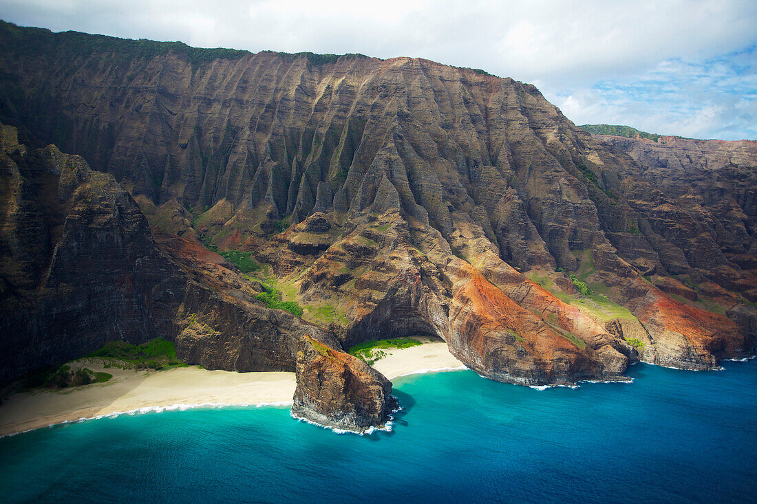 'View of a beach along the rugged coast of an hawaiian island; Hawaii, United States of America'