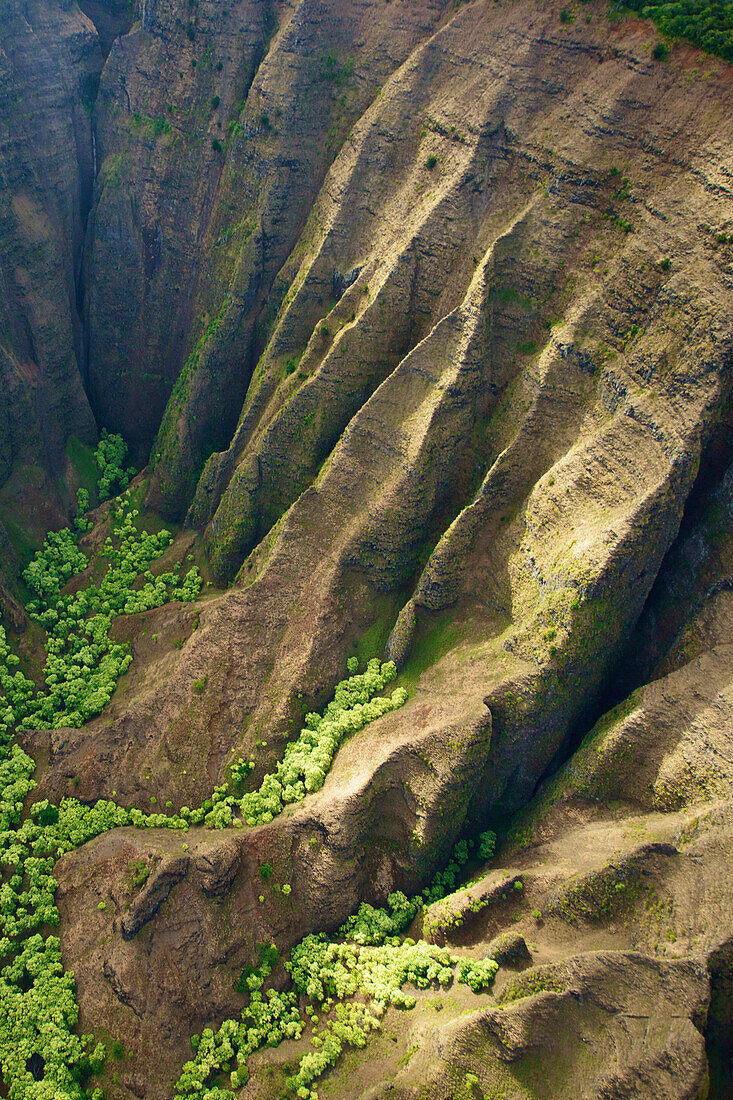 'Aerial view of the rugged landscape along the coast of an hawaiian island; Hawaii, United States of America'