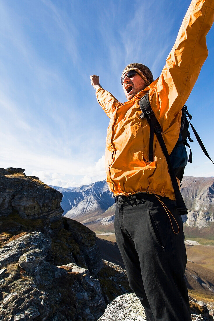 Hiker On Ridge Near Noatak River In The Brooks Range, Gates Of The Arctic National Park, Northwestern Alaska, Above The Arctic Circle, Arctic Alaska, Summer.