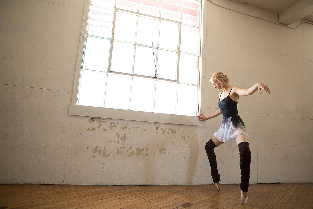Ballet dancer on tip toes in studio
