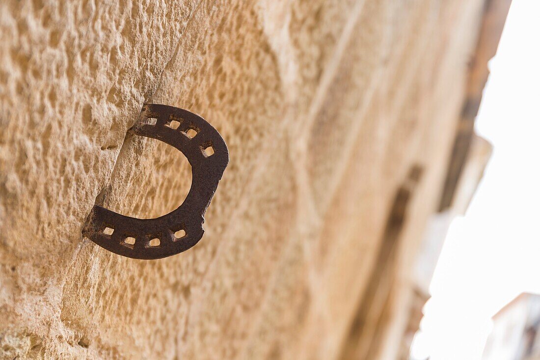 horseshoe in a wall, Cretas, Teruel province, Aragon, Spain.