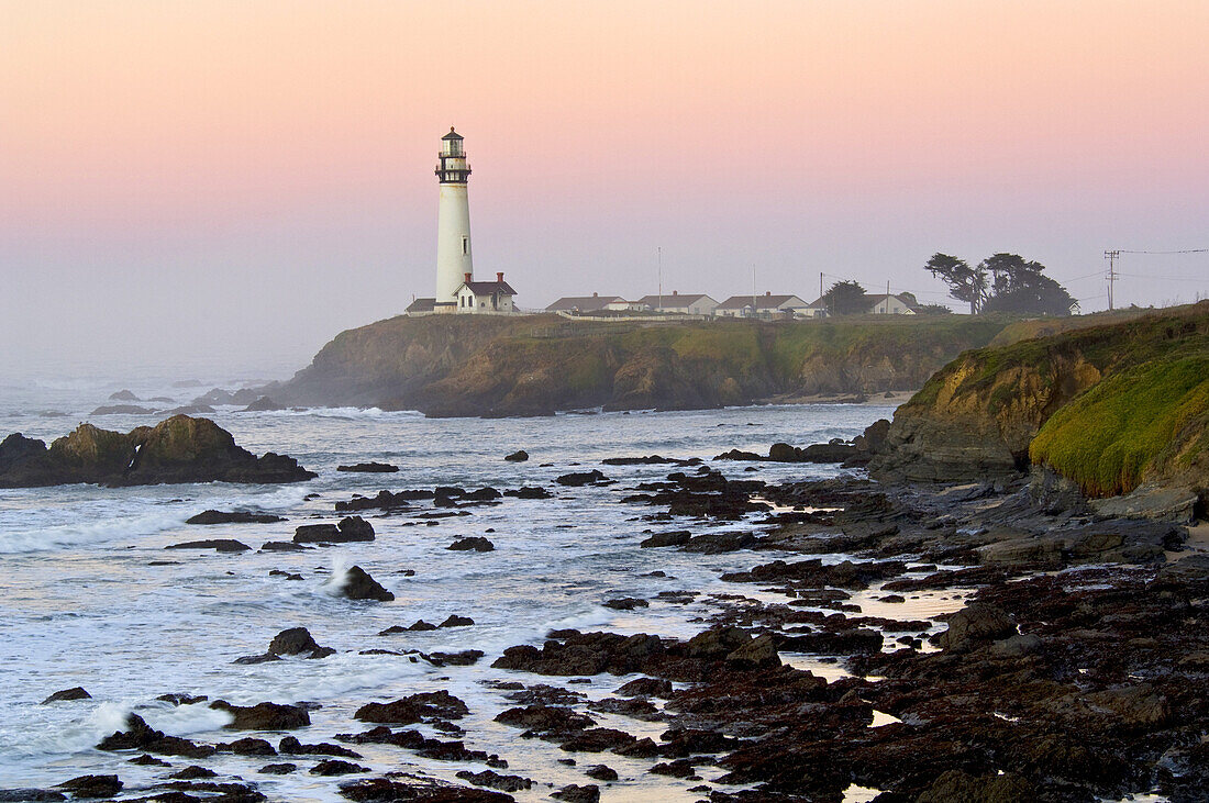 Waves and coastal rocks near Pigeon Point Lighthouse at dawn, San Mateo County coast, California.