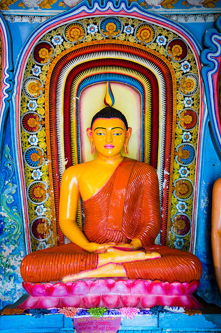 Colourful Buddha statue at Isurumuniya Vihara, Anuradhapura, UNESCO World Heritage Site, Sri Lanka, Asia