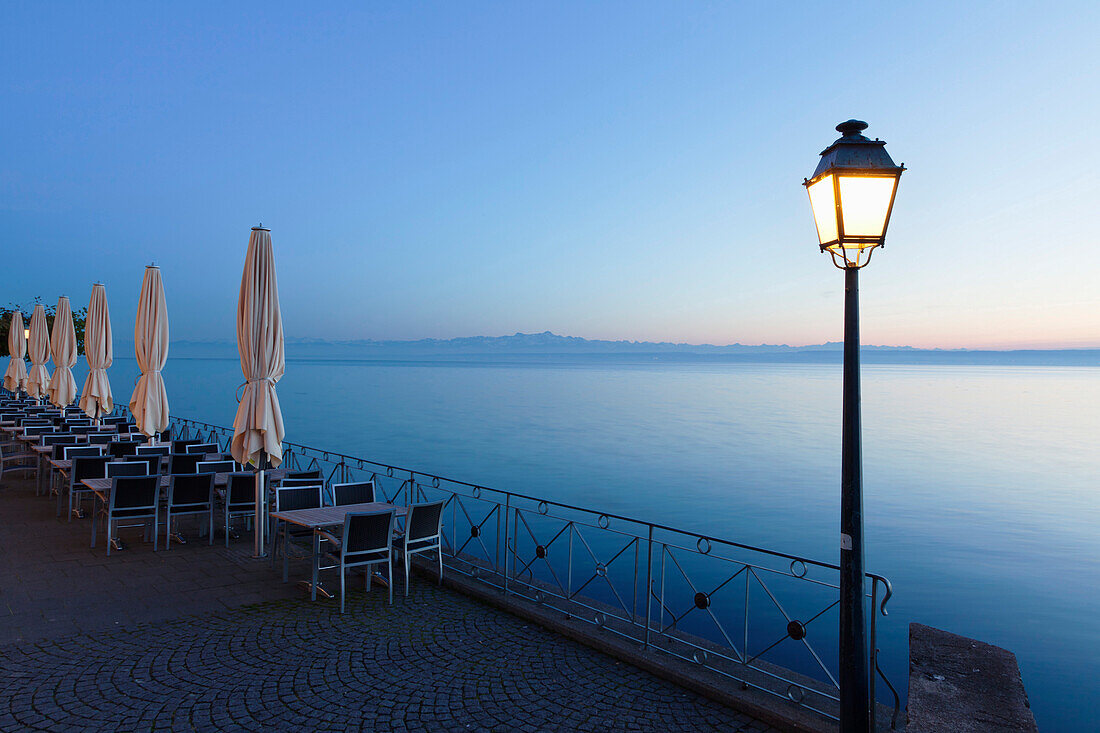 Street cafe on a promenade at sunset, Meersburg, Lake Constance (Bodensee), Baden Wurttemberg, Germany, Europe