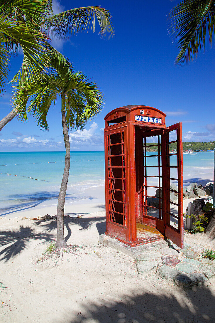 Beach and red telephone box, Dickenson Bay, St. Georges, Antigua, Leeward Islands, West Indies, Caribbean, Central America