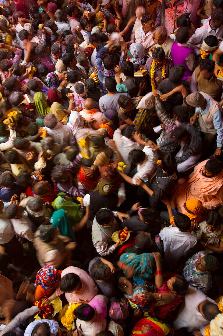 Crowd attending the pulpit of the Banke Bihari temple in Vrindavan, India, during Holi festival