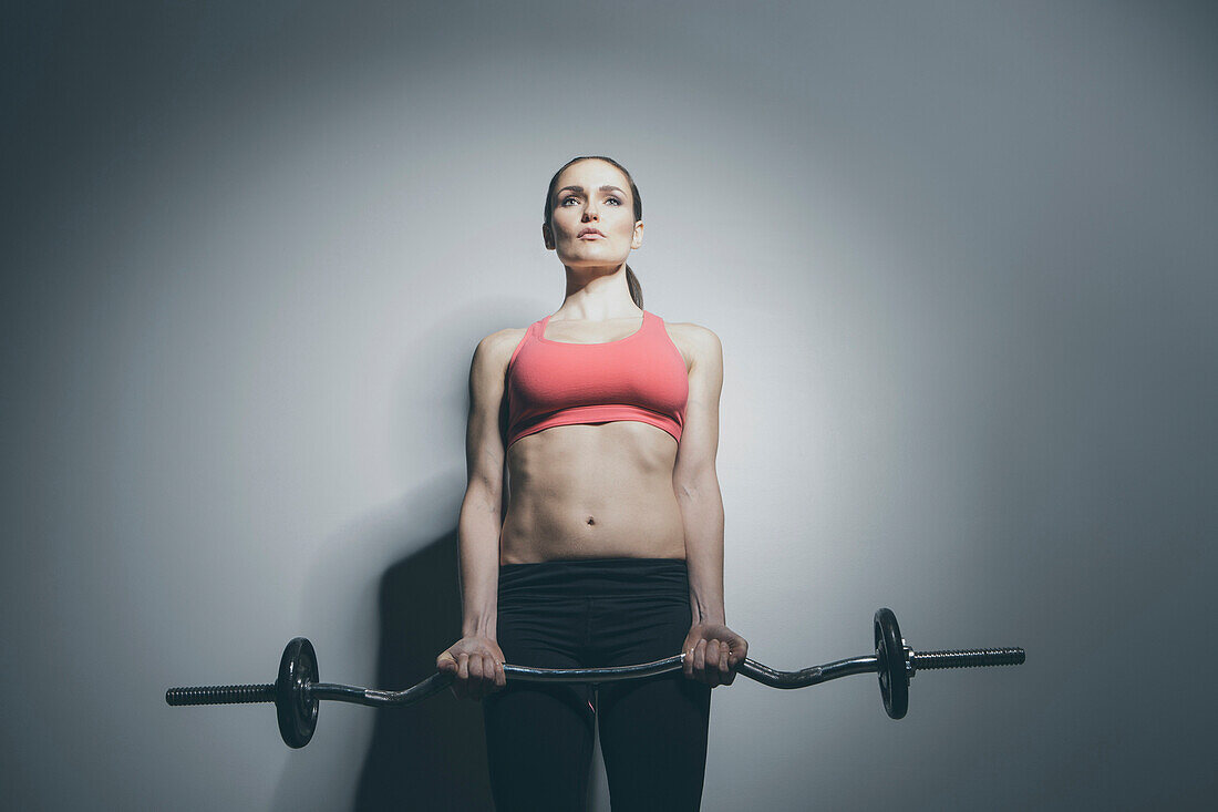 Caucasian woman holding barbell, Saint Louis, Missouri, USA