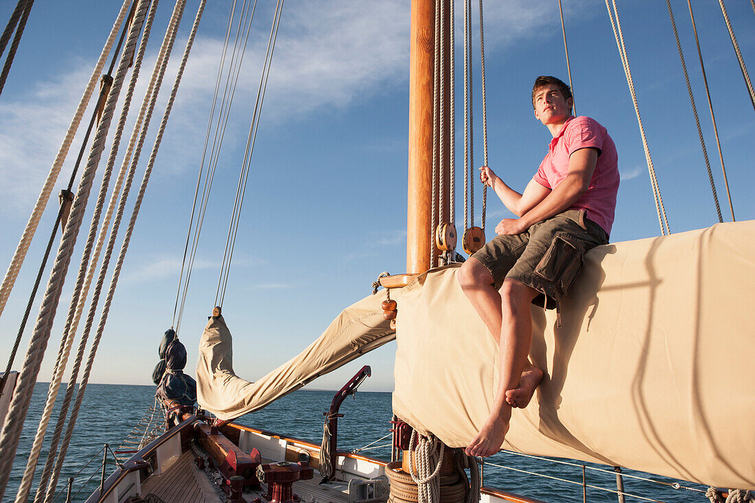 Caucasian man relaxing on sailboat, Cape Town, Western Cape, South Africa