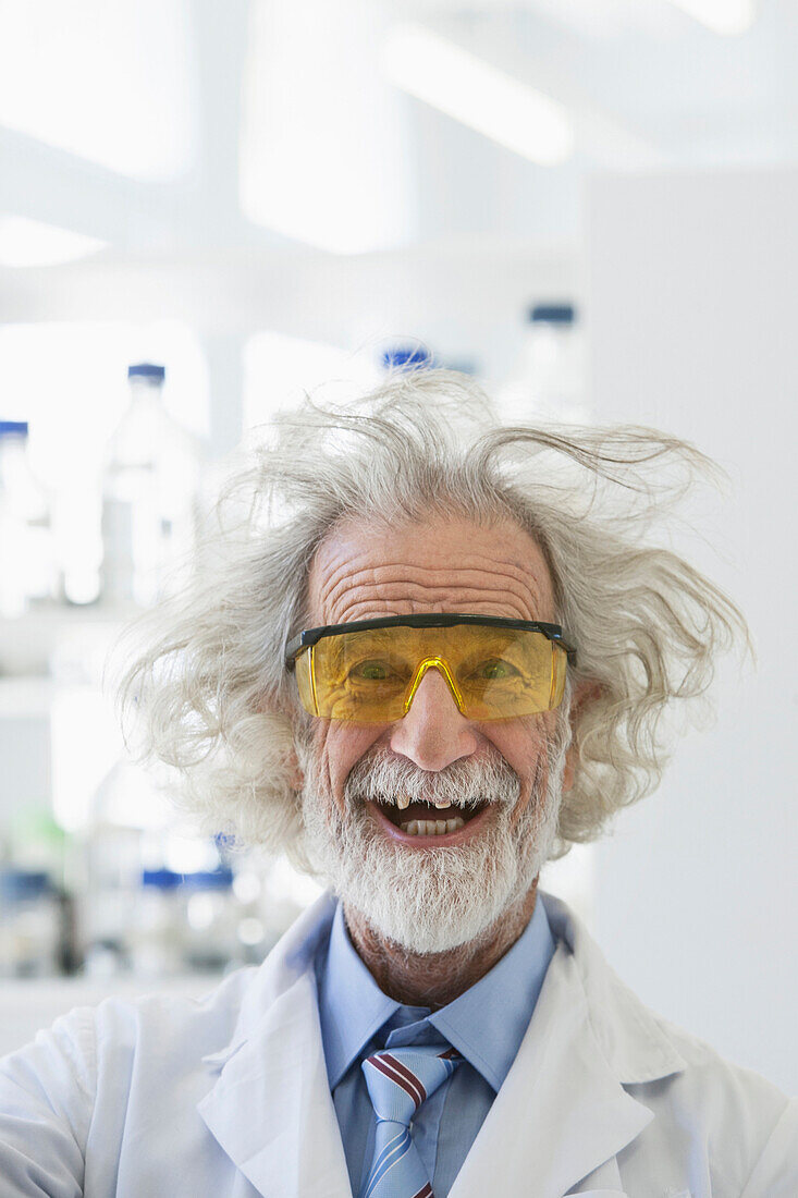 Senior Caucasian scientist with unruly hair in lab, Cape Town, Western Cape, South Africa