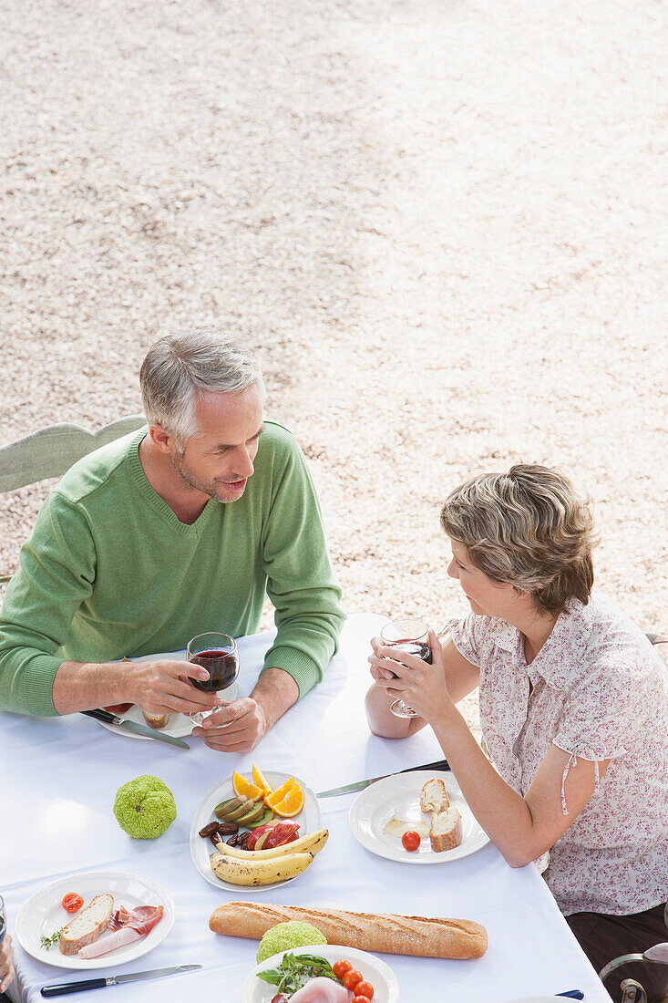 Couple eating together outdoors, Palma de Mallorca, Balearic Islands, Spain