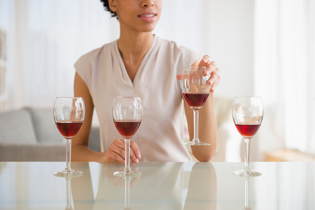 Black woman tasting wine, Jersey City, New Jersey, USA