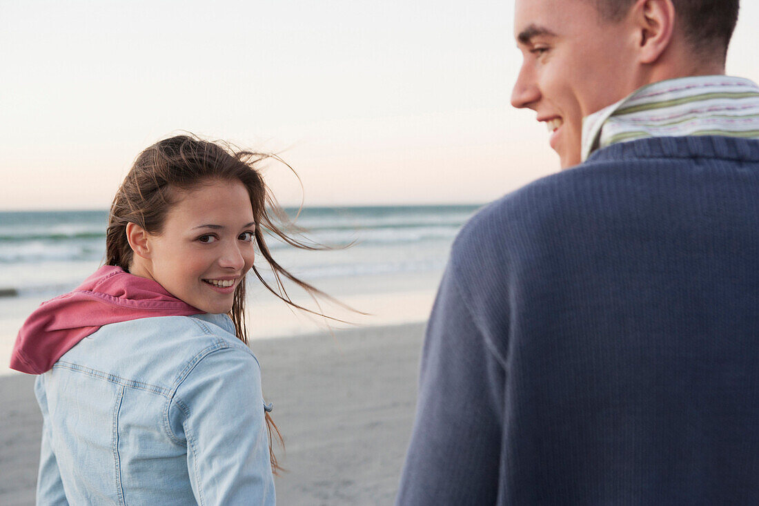 Caucasian couple walking on beach, Cape Town, Western Cape, South Africa