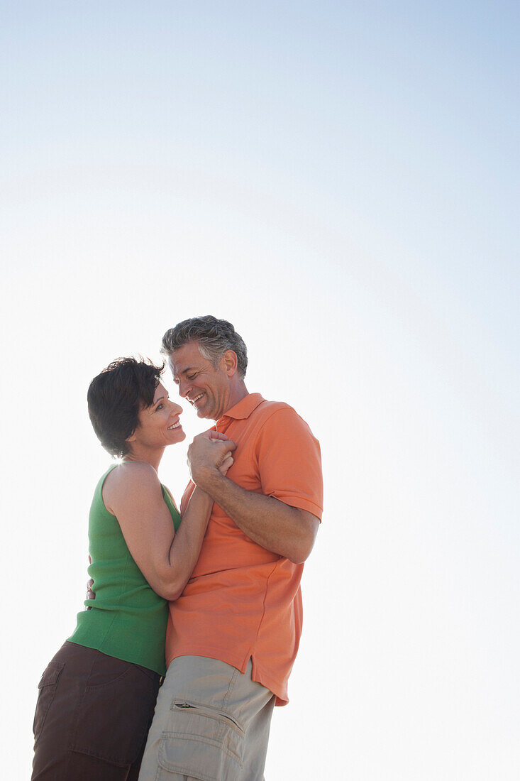 Caucasian couple hugging outdoors, Los Angeles, California, United States