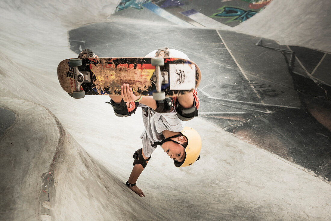Mixed race boy riding skateboard in skate park, Nayarit, Riviera Nayarit, Mexico