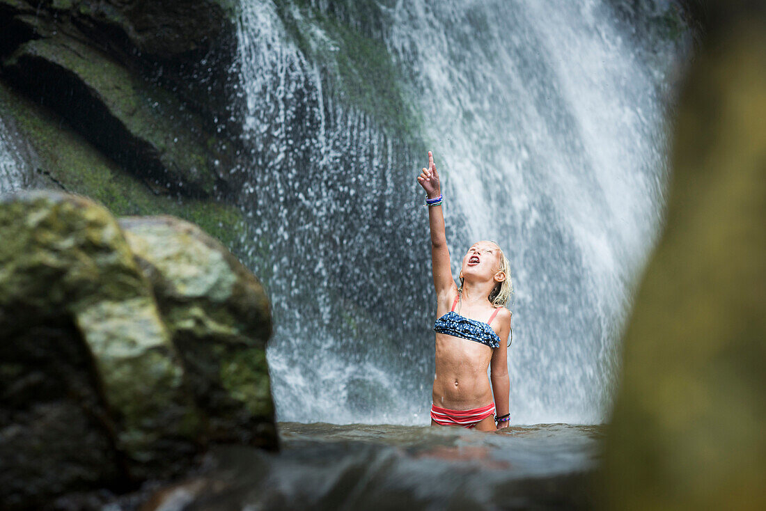 Caucasian girl playing in jungle waterfall, Sayulita, Nayarit, Mexico
