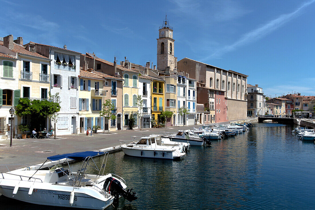 Boats along the embankment, church in the background, Martigues, Southeastern France