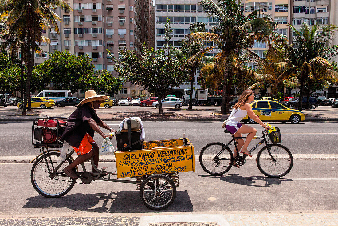 Brazil, Rio de Janeiro, Copacabana, musician on a tricycle playing samba during the carnival