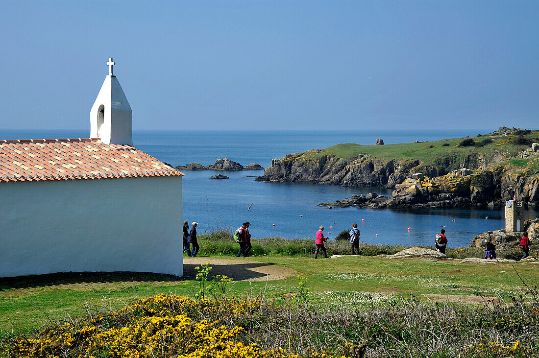 France, Vendée, Ile d'Yeu, small church looking down on La Meule port and the sea.