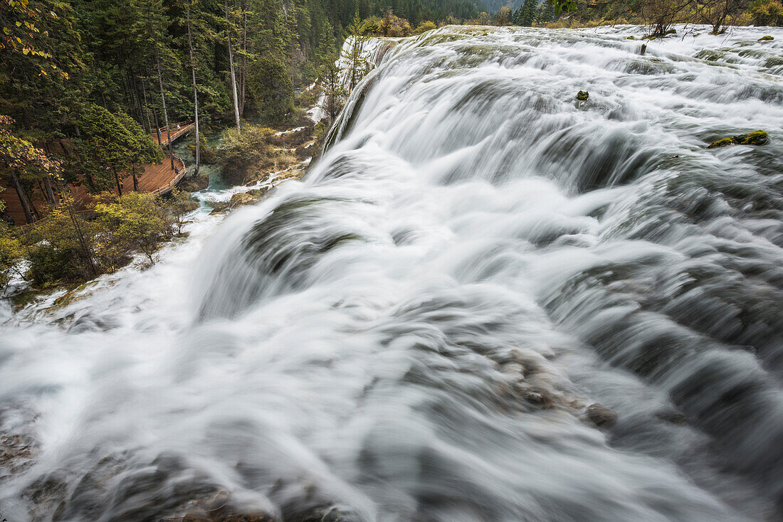 'Blurred Water Of The Huge Waterfall Cascade At Jiuzhaigou Valley National Park; Jiuzhaigou, Sichuan, China'