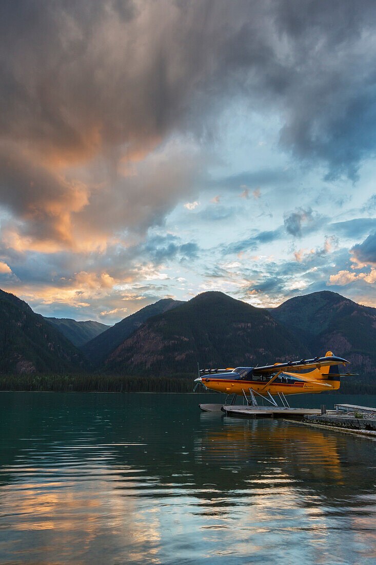 'A Float Plane On Muncho Lake At Sunset; British Columbia, Canada'