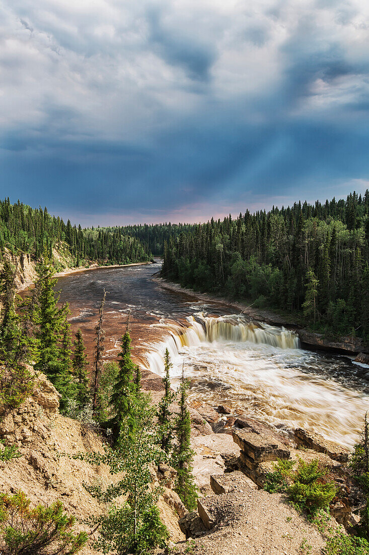 'Sunlight Illuminates The Trout River Flows Over Coral Falls; Northwest Territories, Canada'