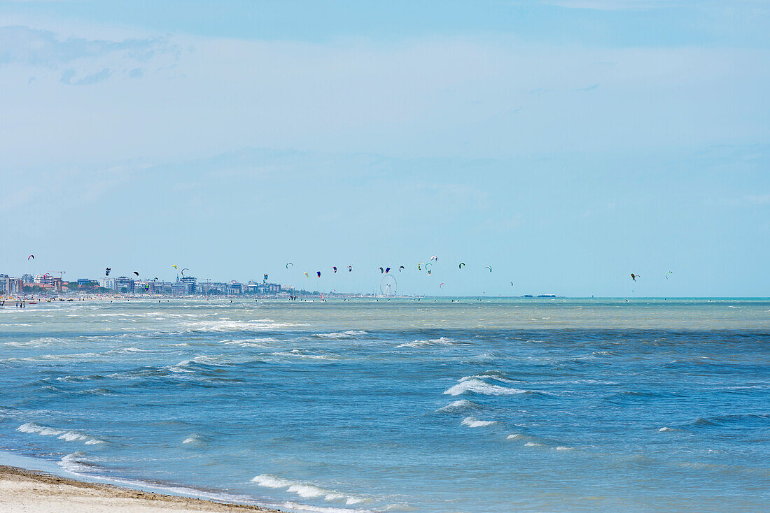 'Kitesurfing In The Distance Along The Coastline; Rimini, Emilia-Romagna, Italy'