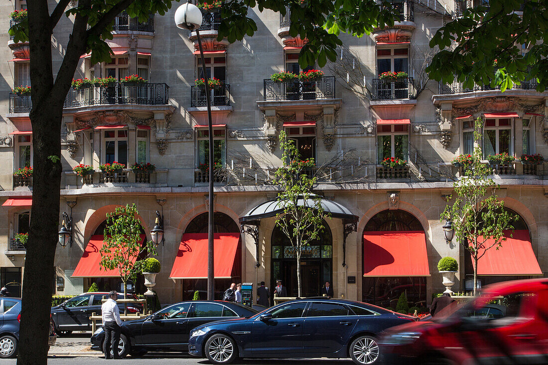Deluxe car in front of the hotel plaza athenee, avenue montaigne, 8th arrondissement, paris, france