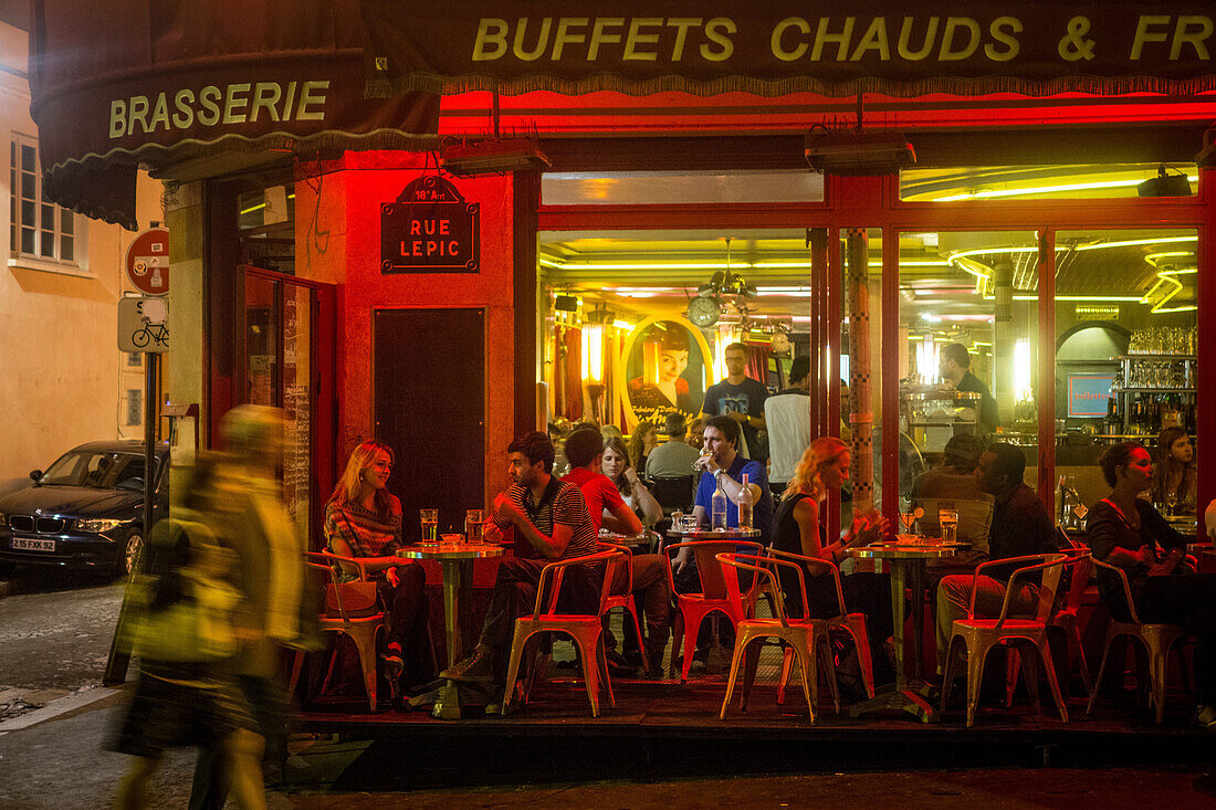 Ambiance at a parisian cafe restaurant at night, rue lepic, paris (75), france